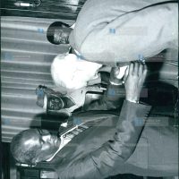 President Daniel Arap Moi invests Mr. Humphrey Slade (right) as a Knight of Grace of the Most Venerable Order of the Hospital of St. John