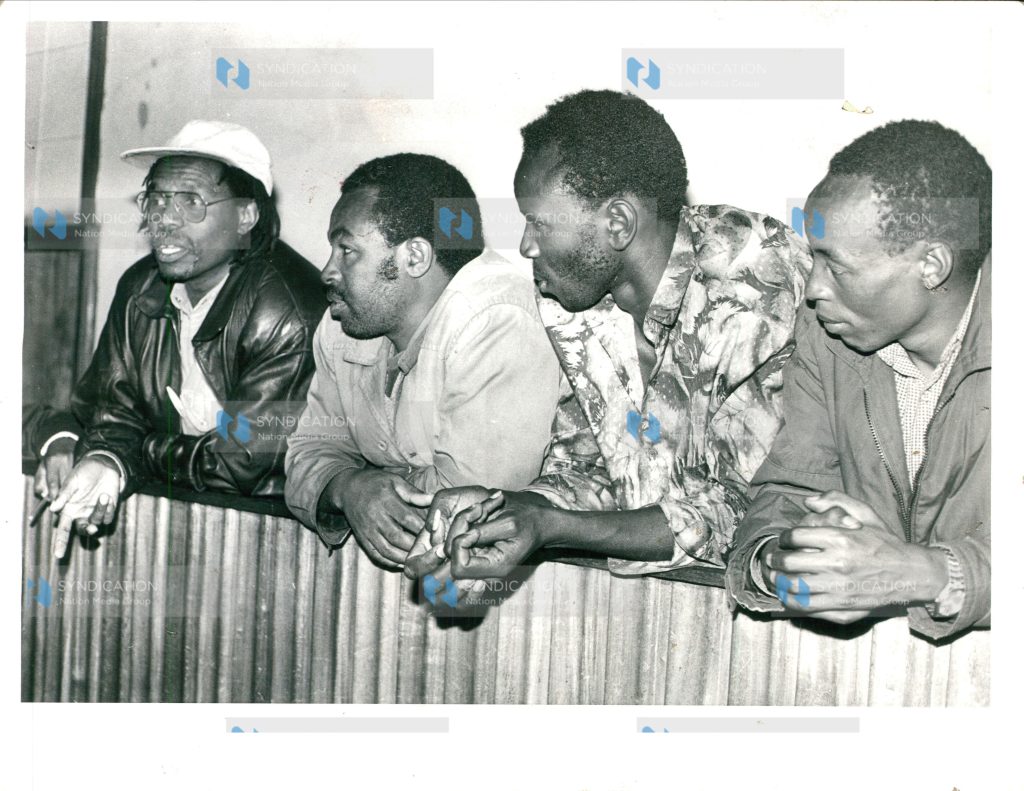 Former Nakuru North MP Koigi wa Wamwere (in cap) and six other people including a woman
