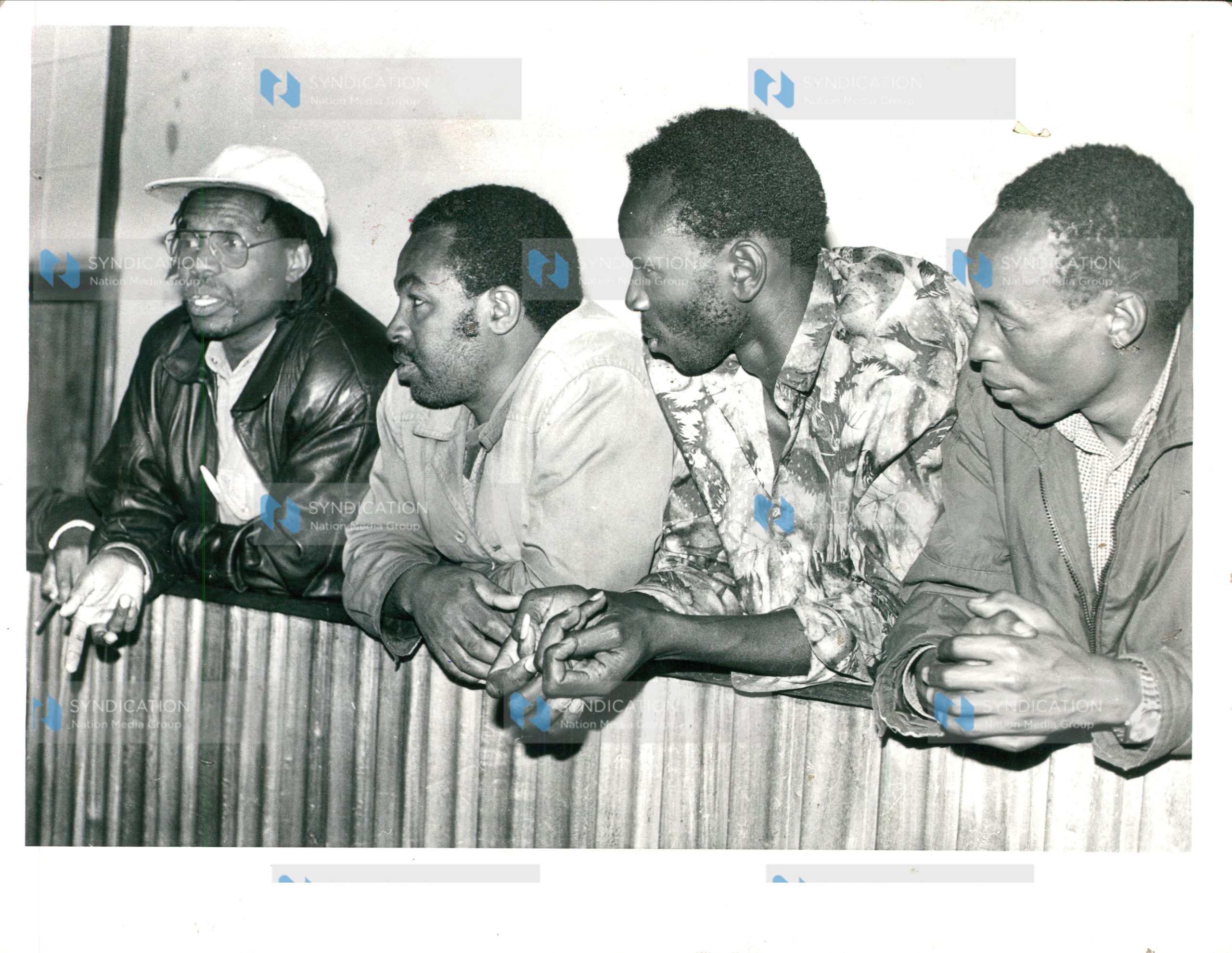 Former Nakuru North MP Koigi wa Wamwere (in cap) and six other people including a woman