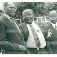 Vice President George Saitoti (left), chats with the Minister for Manpower Development and Employment, Mr. Oloo Aringo (center)