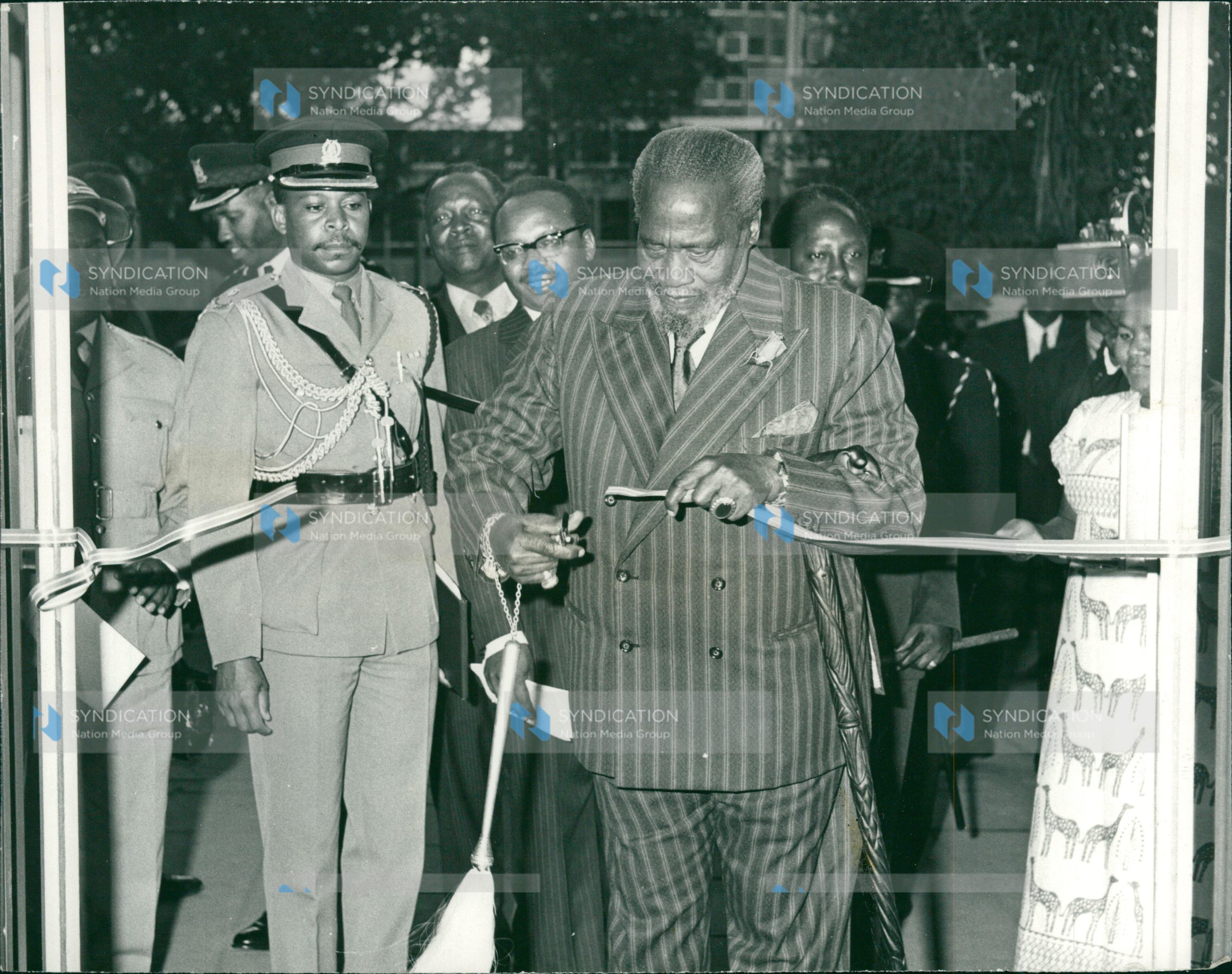 President Mzee Jomo Kenyatta cuts a tape to officially open Uchumi House along Aga Khan Walk