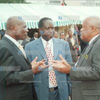 Vice-President Moody Awori (left) chats with Cabinet ministers Joseph Munyao (right) and Raila Odinga