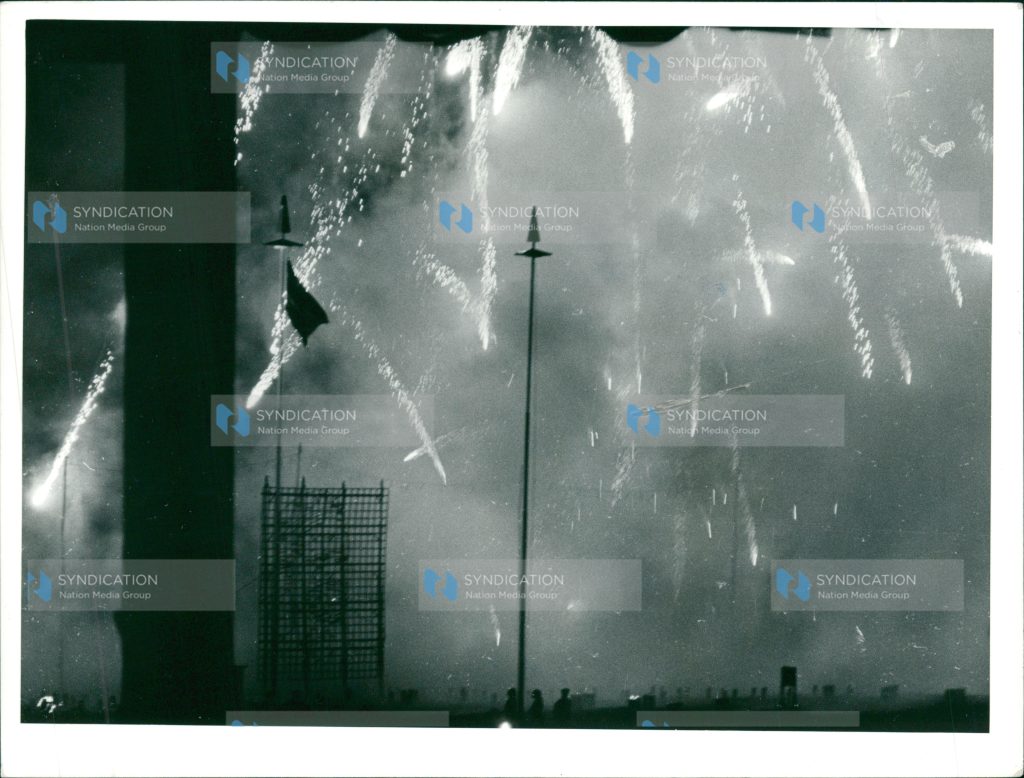 Fireworks light the sky as the Kenyan flag fly high