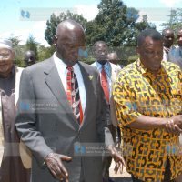 Former President Daniel Arap Moi chats with former Presidential Service Unit staff Leonard Mambo Mbotela