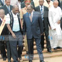 President Mwai Kibaki is escorted out of the Holy Family Basilica by Gatundu North MP Mr. Patrick Muiruri