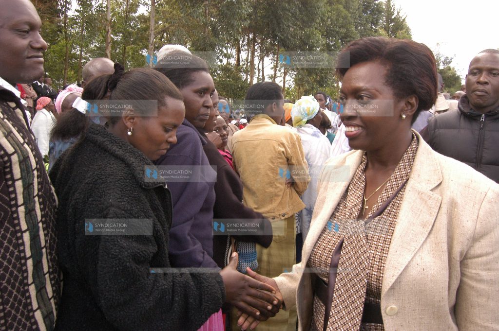 Gichugu MP Martha Karua(right) meets mourners after a prayer meeting