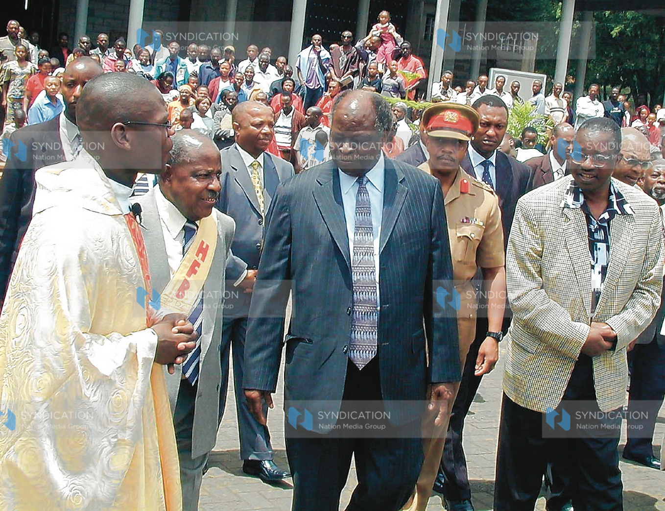 President Mwai Kibaki, Planning minister Henry Obwocha and Father Ignatius Omondi