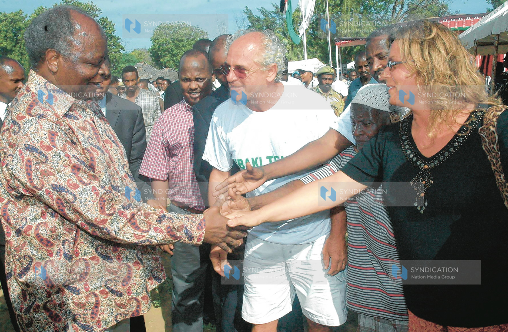 President Mwai Kibaki is bid farewell by some tourists