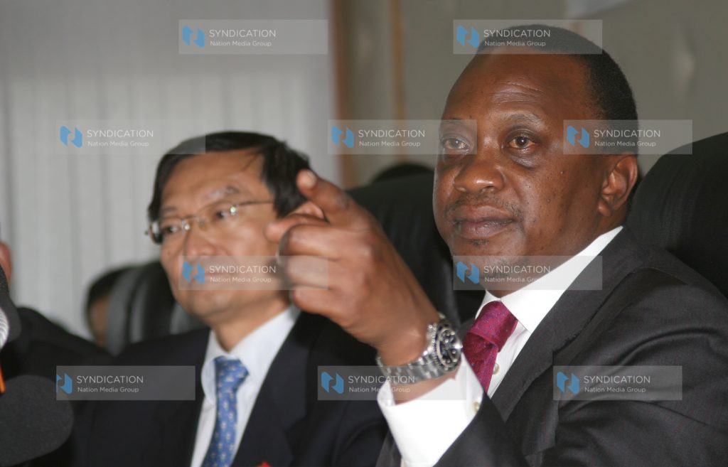 Deputy Prime Minister and Minister for Finance Uhuru Kenyatta and Zhang Ming, Chinese Ambassador