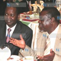 Finacial minister Amos Kimunya discusses with his assistant Oburu Odinga