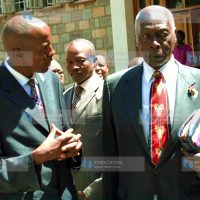 Former President Daniel Arap Moi listens to Rev. Justus Mutuku