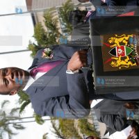 Finance Minister Uhuru Kenyatta arrives with his briefcase for this year's presentation of the budget