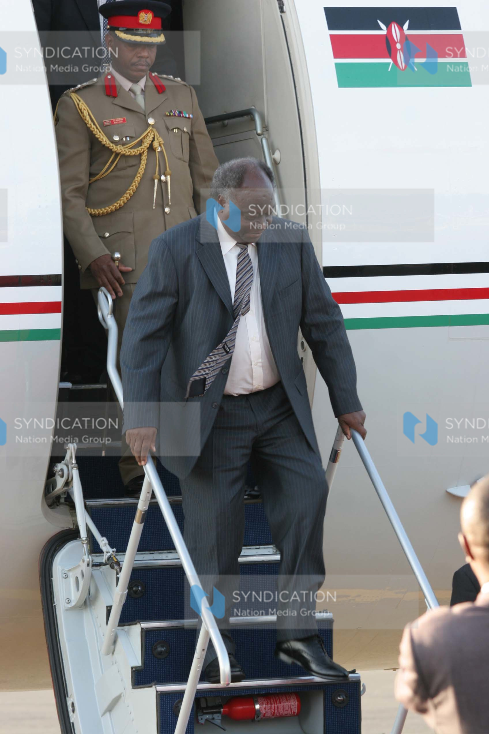 President Mwai Kibaki alights from his jet