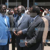 President Mwai Kibaki talks with Prime Minister Raila Odinga and Vice president Kalonzo Musyoka