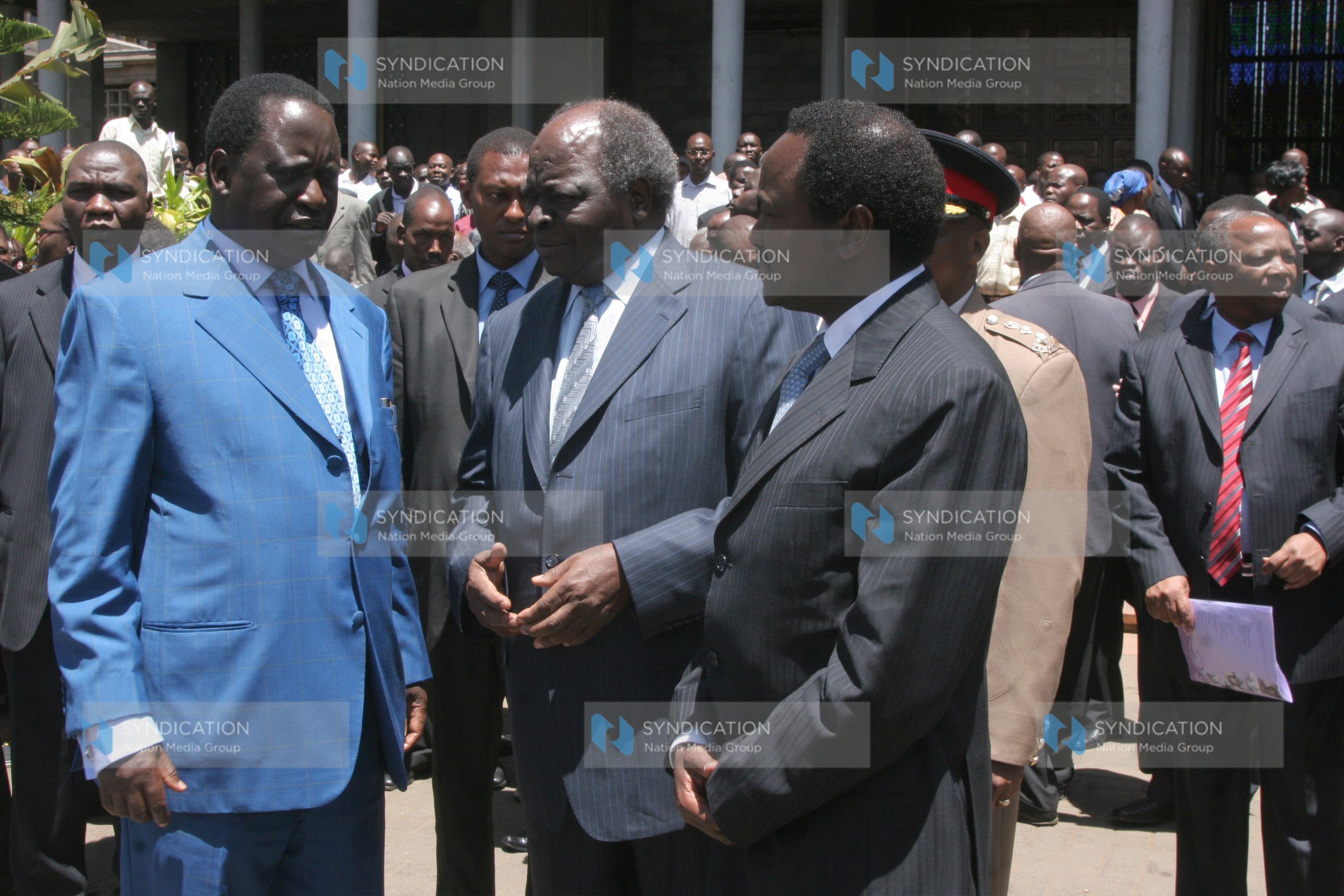 President Mwai Kibaki talks with Prime Minister Raila Odinga and Vice president Kalonzo Musyoka