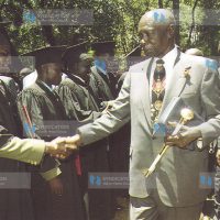 Former President Daniel Arap Moi congratulates one of the Graduands