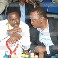 Vice President Kalonzo Musyoka consults with Deputy Prime Minister Uhuru Kenyatta
