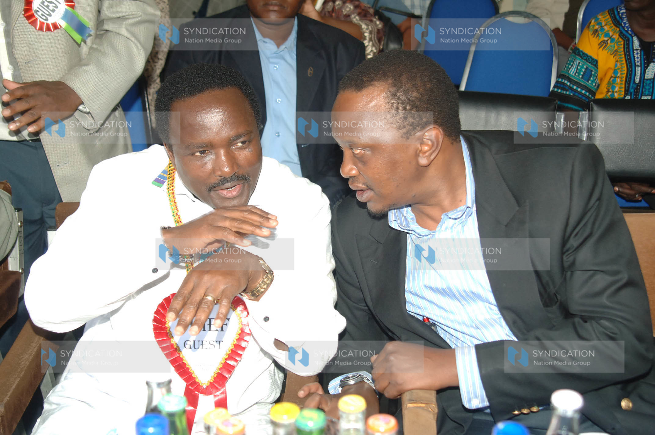Vice President Kalonzo Musyoka consults with Deputy Prime Minister Uhuru Kenyatta