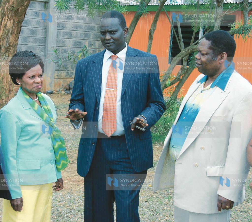 ODM-Kenya Chairman Samuel Poghishio chats with presidential candidate running-mate Dr Julia Ojiambo