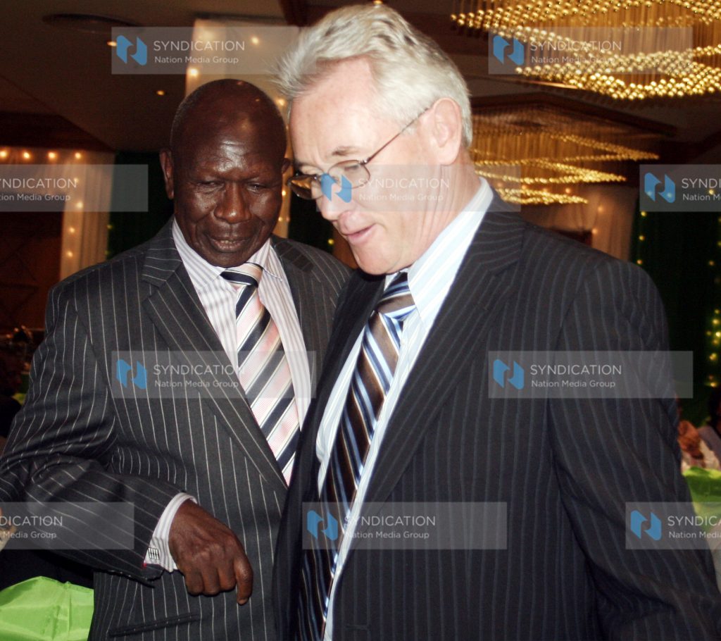 Former Vice President Dr. Moody Awori share a word with the Safaricom Foundation Chairman Mr. Les Baillie