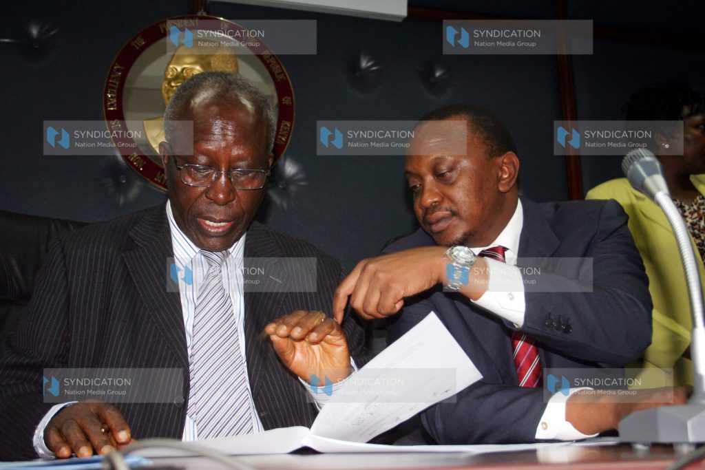 Minister for Education Prof. Sam Ongeri, flanked by Deputy Prime Minister and Minister for Finance Uhuru Kenyatta