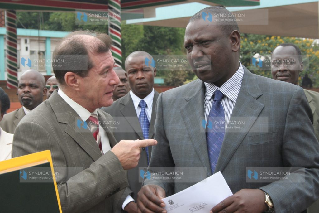 Agriculture minister William Ruto chats with the Egyptian ambassador Saher Hamza