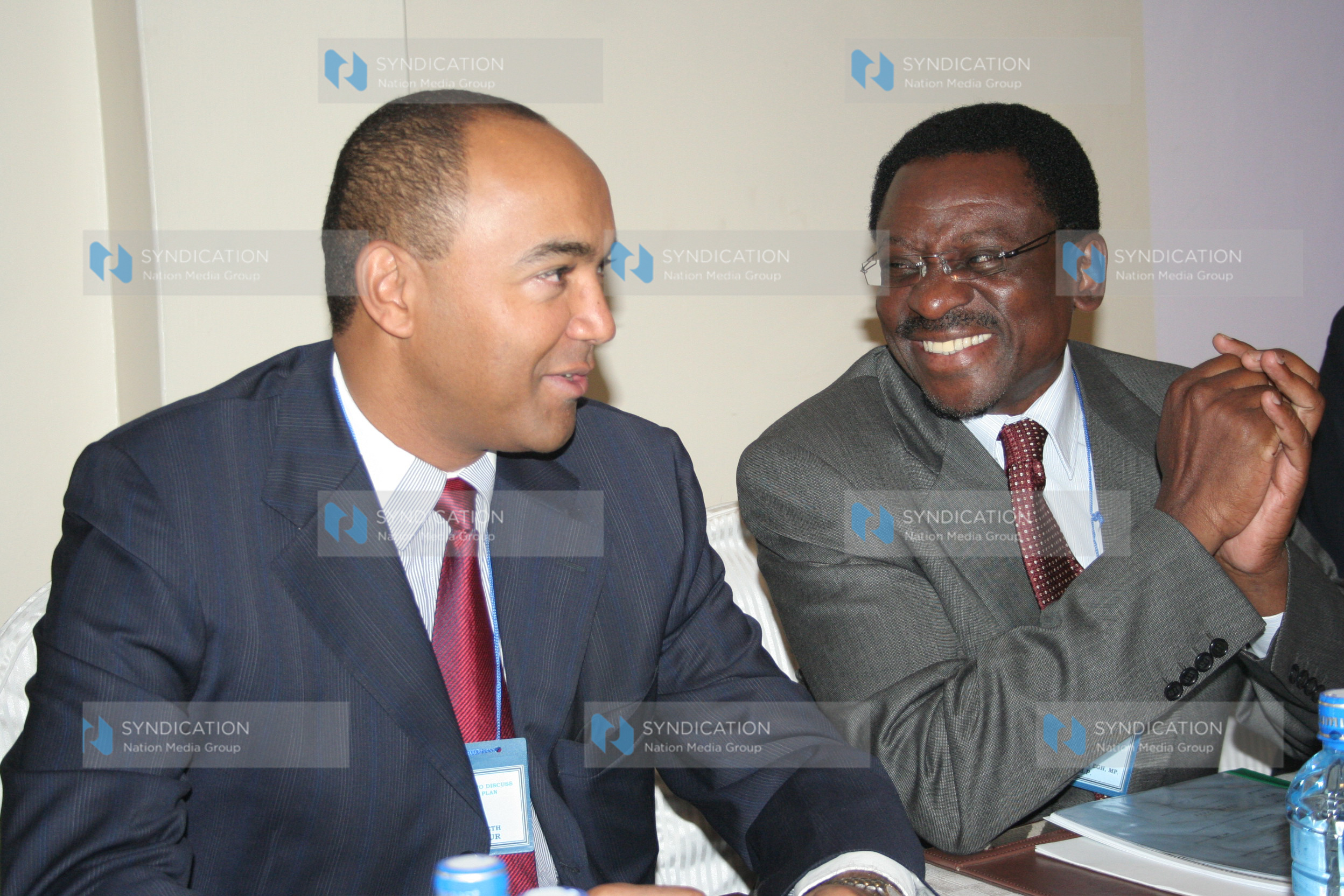 Lands Minister and Ugenya MP James Orengo shares a light moment with Planning Assistant Minister Peter Kenneth