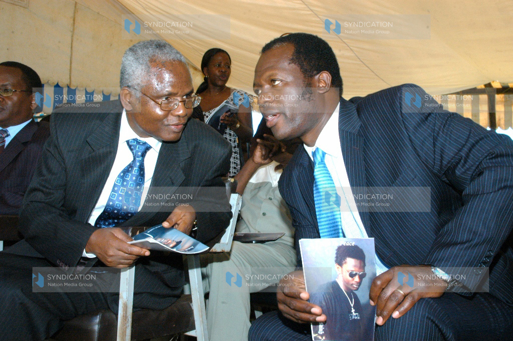 Public Service PS Francis Muthaura chats with former Foreign Affairs Minister Raphael Tuju