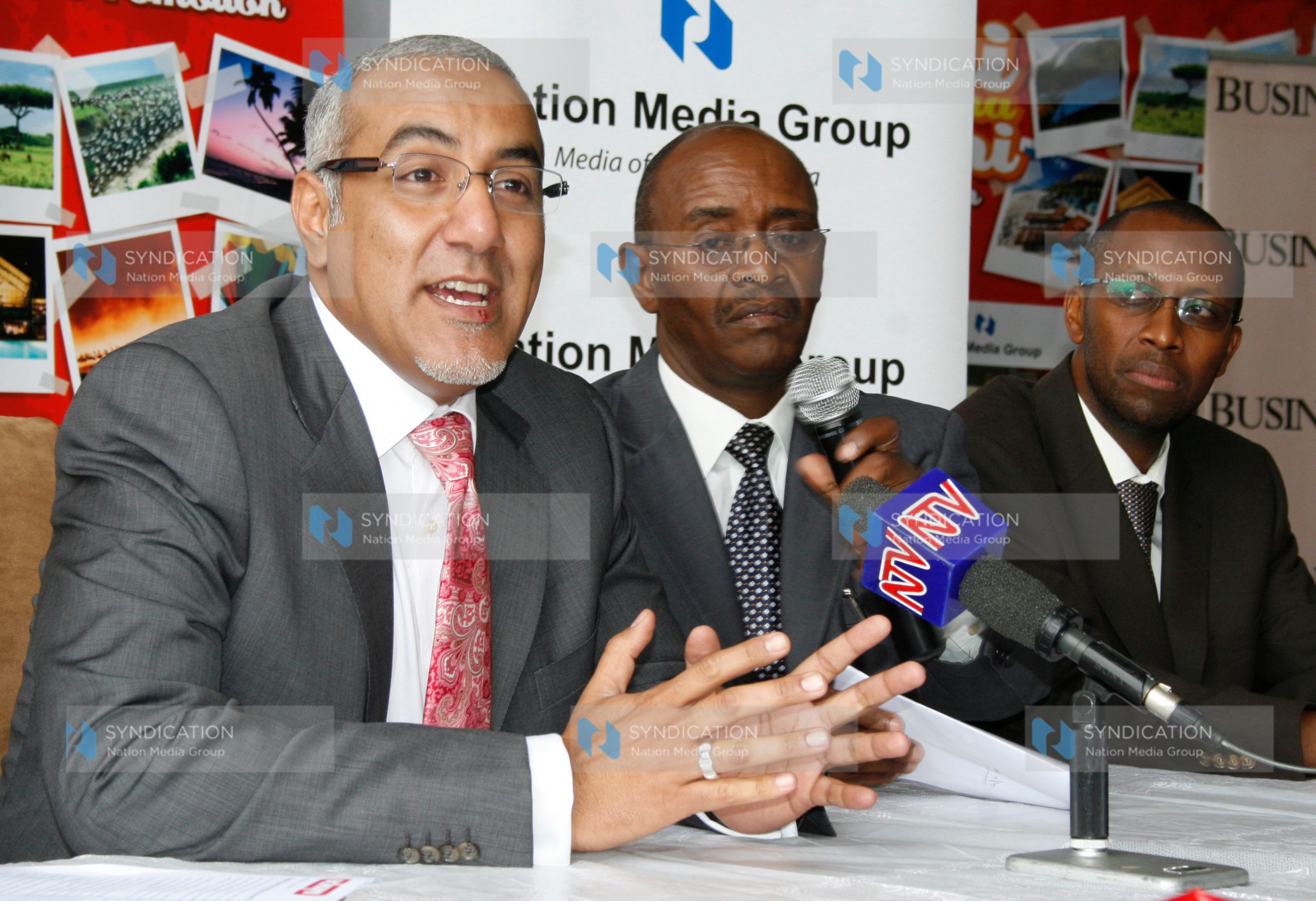 Tourism minister Najib Balala flanked with Uchumi managing director Jonathan Ciano and NMG general manager marketing Dr Githai Githinji