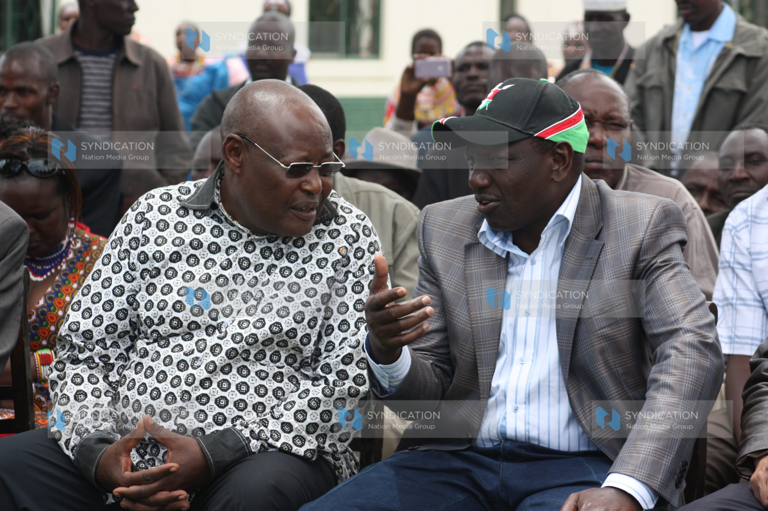 Former Speaker Francis Ole Kaparo chats with William Ruto