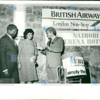 Munira Pirbahai, a secretary with E A Packaging Industries receives a return air ticket to London from Mrs. Chris Cross, British Airways' manager for Kenya Mr. John Macharia, the airline's sales manager