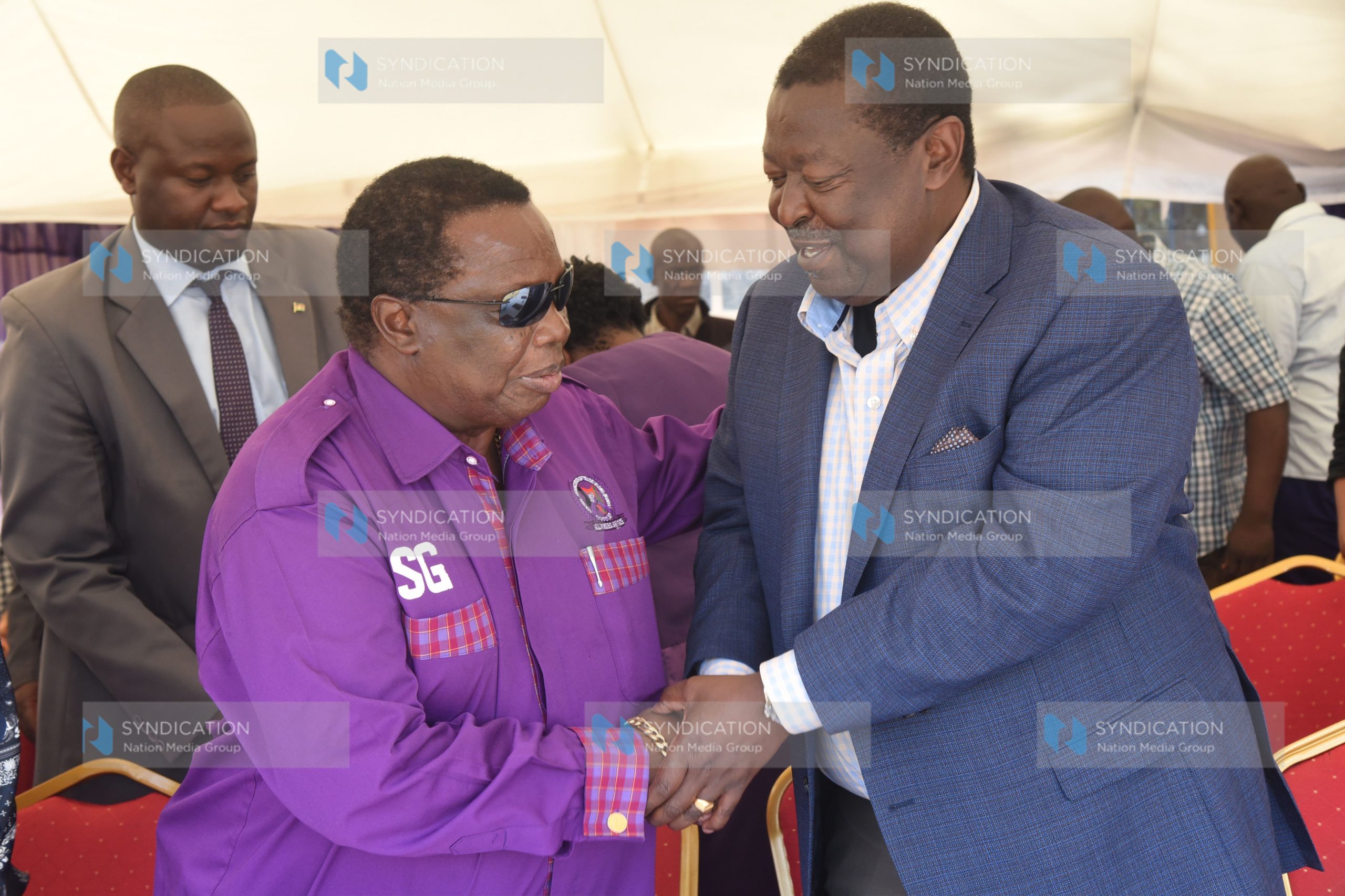 Prime Cabinet Secretary Musalia Mudavadi shake hand with COTU Secretary general Francis Atwoli