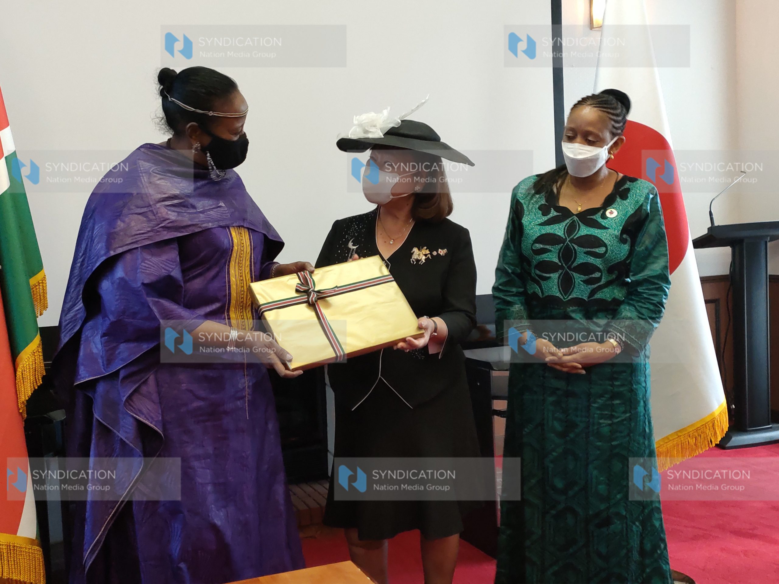 Sports Cabinet Secretary Amina Mohamed hands over a gift to U.S.E. Company Limited Chairman Kyoko Yoshihiro