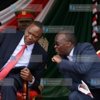 President Uhuru Kenyatta consulting with Health Cabinet Secretary James Macharia