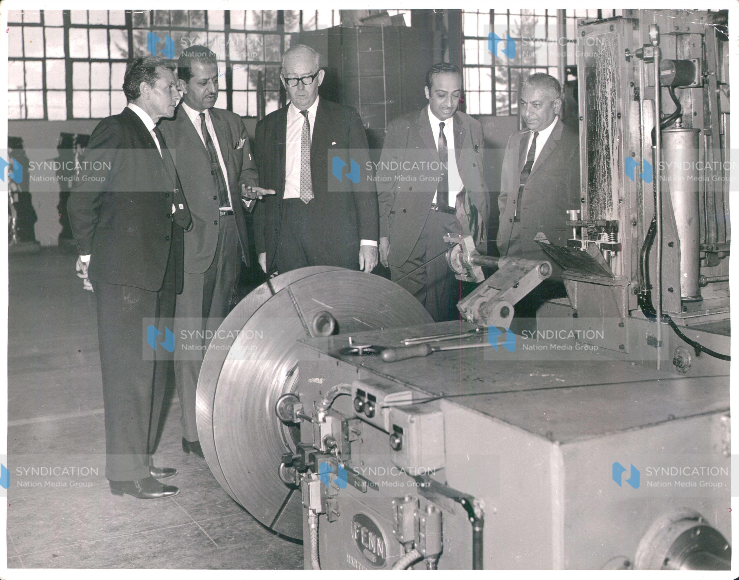 British High Commissioner in Uganda D.A. Scott is pictured with Jayant Madhvani and Manubhai Madhvani, directors of the Madhvani Group