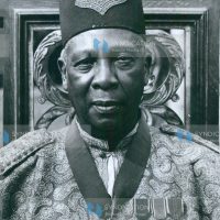The image shows Sir Tito G. Winyi IV, C.B.E., Omukama of Bunyoro Kitara