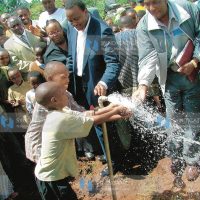 Deputy Prime Minister Uhuru Kenyatta with Gatundu South Water and Sanitation Company chairman Samuel Gatama