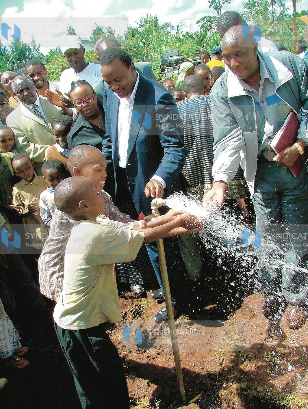 Deputy Prime Minister Uhuru Kenyatta with Gatundu South Water and Sanitation Company chairman Samuel Gatama