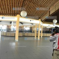 A cameraman at the main restaurant of the Coral-Palm Beach Hotel