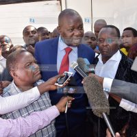 Lawyer Tom Ojienda (in red tie) addresses the press after his client