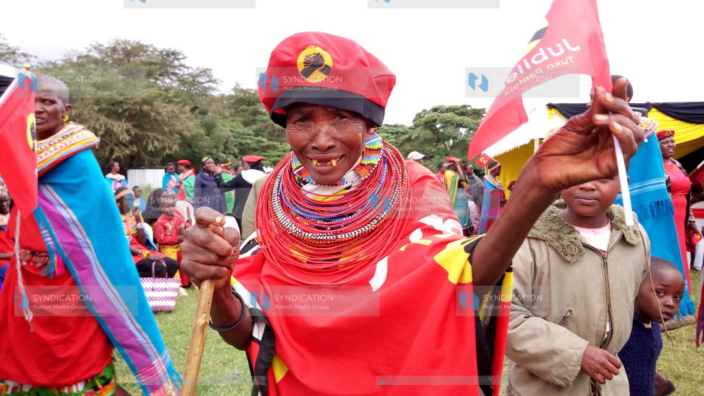 An elderly woman in Jubilee Party regalia at Allamano Grounds