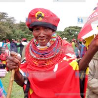 An elderly woman in Jubilee Party regalia at Allamano Grounds