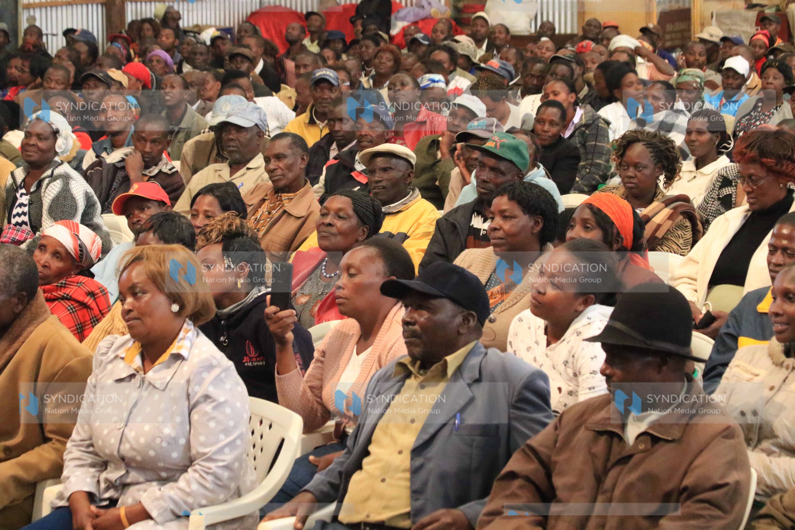 Members of the public follow proceedings in a meeting addressed by Nyeri County Jubilee senate candidate Ephraim Maina