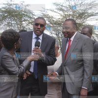 President Uhuru Kenyatta listens as Mukurweini MP Kabando wa Kabando