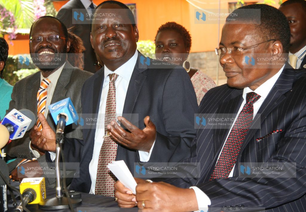 Raila Odinga (centre) flanked by former Speaker of the National Assembly Kenneth Marende (right)