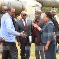 President Uhuru Kenyatta greets Nyandarua County woman representative Faith Gitau