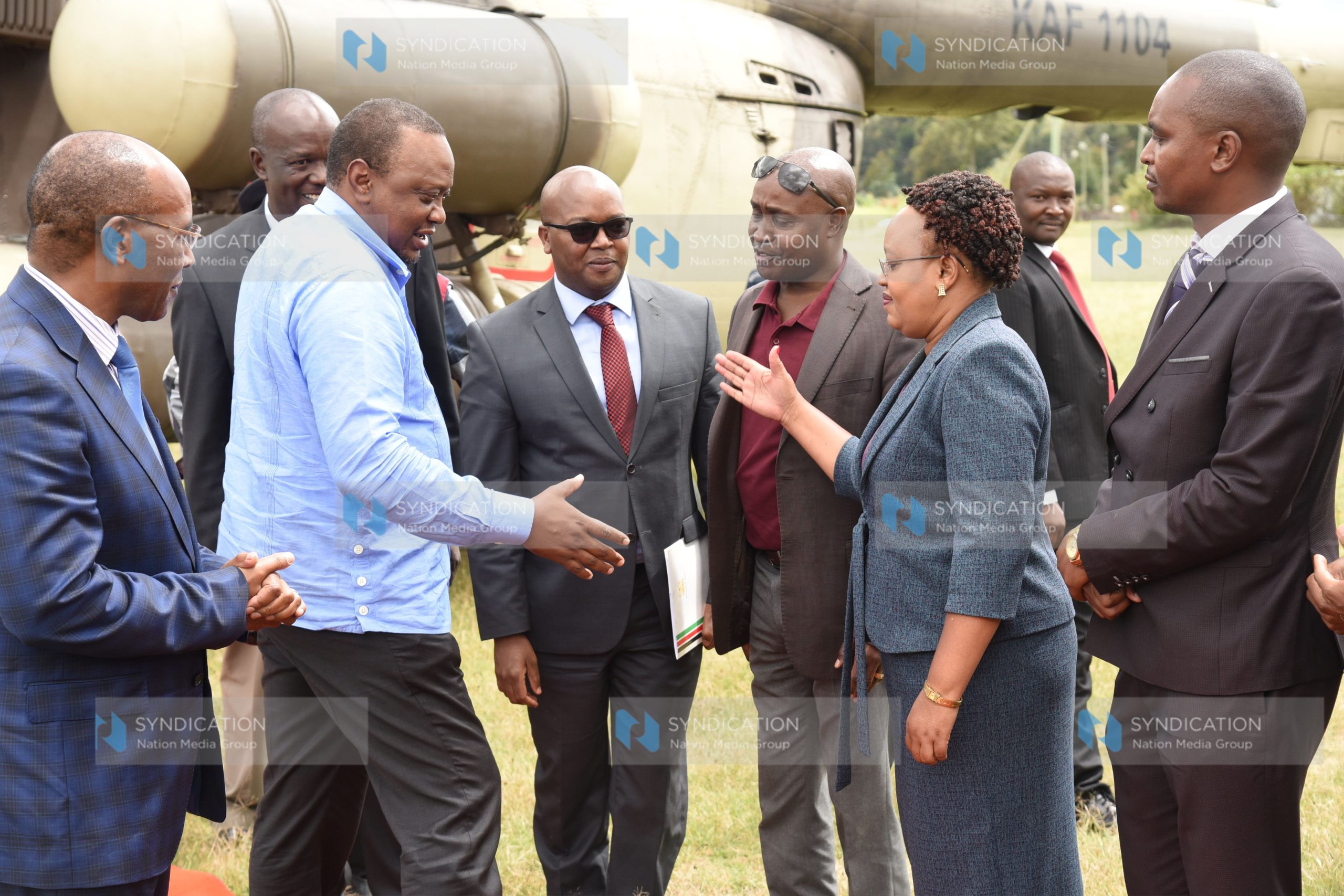President Uhuru Kenyatta greets Nyandarua County woman representative Faith Gitau