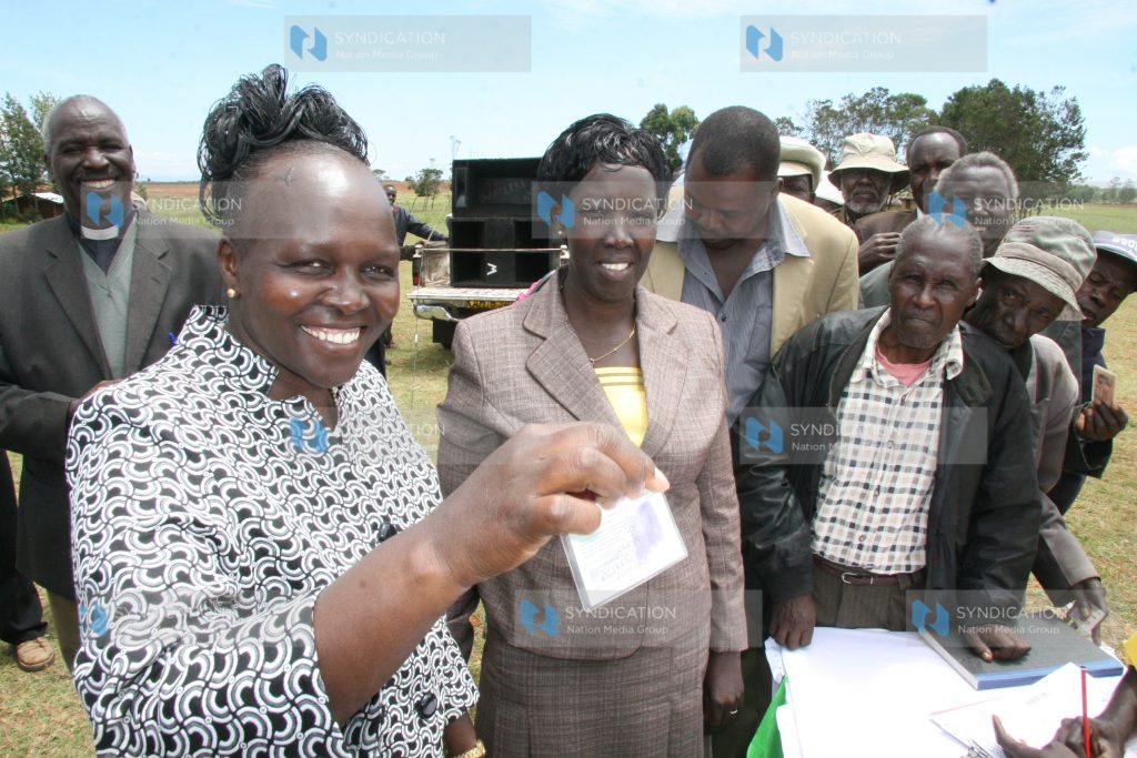 Eldoret East MP Prof. Margaret Kamar displays her new voter’s card