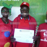 Julius Sunkuli displays his nomination certificate