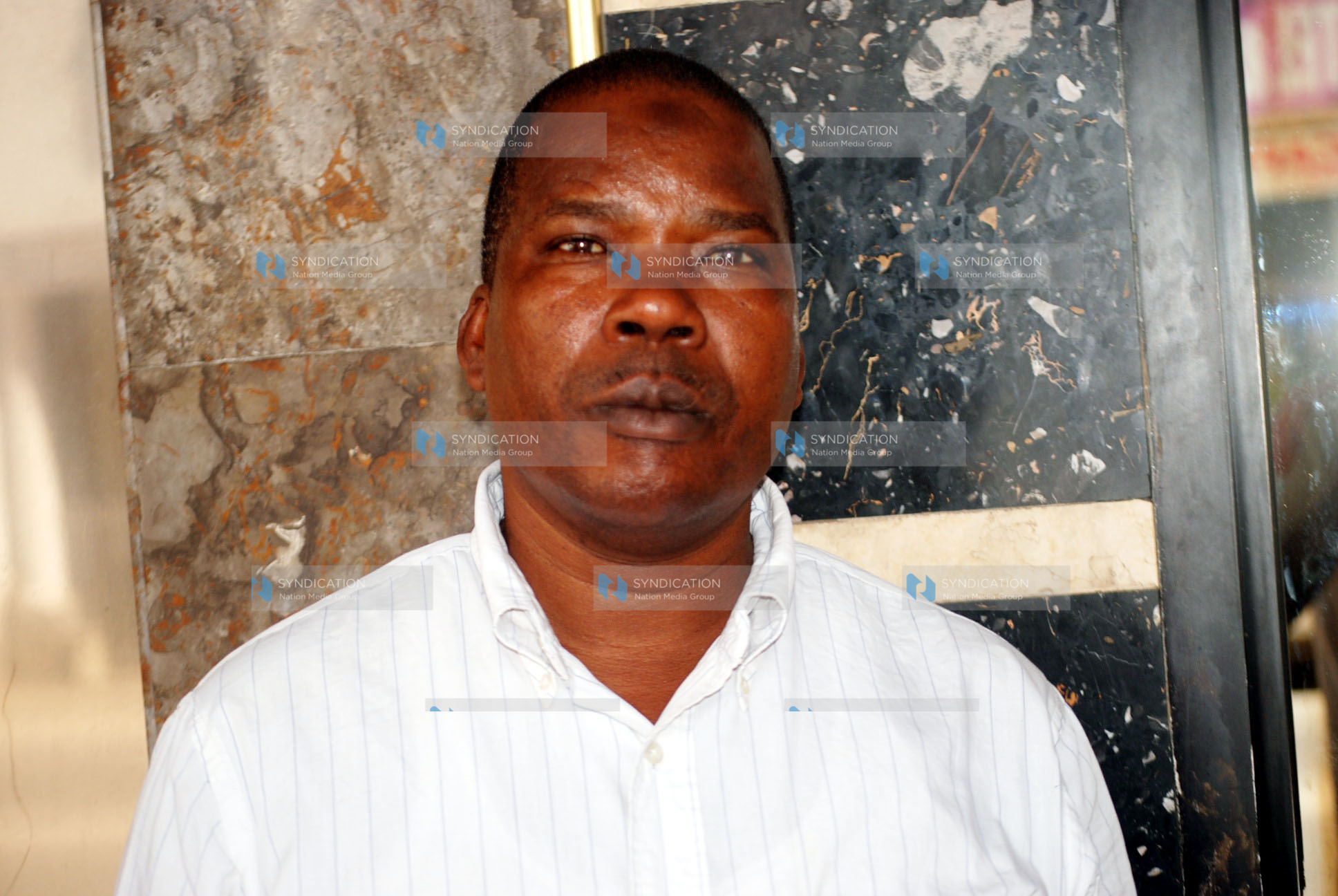 Mr. Ibrahim Langila, a 50-year-old newspaper vendor